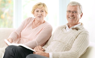 Couple reading hearing information booklet